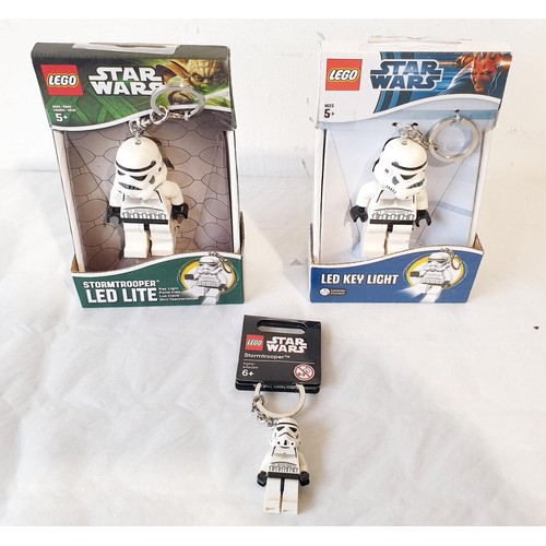 43 - A sealed Lego Star Wars Kylo Ren LED Key Lite, two Stormtrooper LED Lites and two Darth Vader LED Ke... 