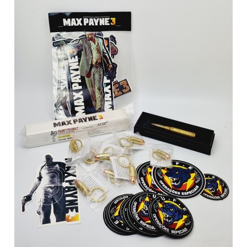 198 - Max Payne 3 promotional items: Painkillers pill box, a boxed gold bullet pen and assorted stickers, ... 