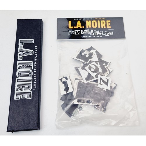 202 - LA Noire promotional items: a boxed N473-3-1B flashlight, a pack of LA Noire pencils and serial kill... 