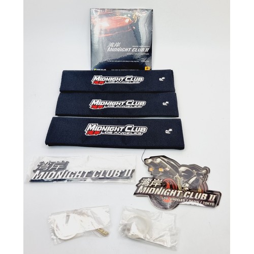 203 - Midnight Club promotional items: three Los Angeles seat belt covers/pads, a soundtrack sampler, keyr... 