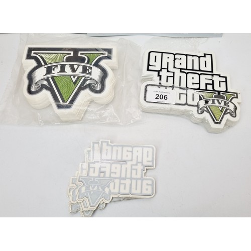 206 - A pack of Grand Theft Auto V window promotional stickers and assorted GTA V stickers. UK shipping £1... 