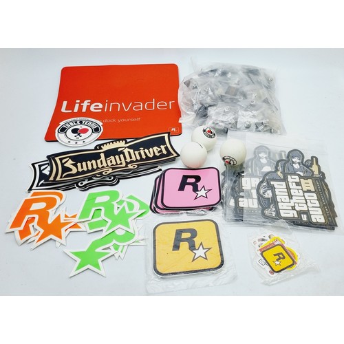 211 - Rockstar Games promotional items: fifty Social Club badges, table tennis balls and assorted stickers... 