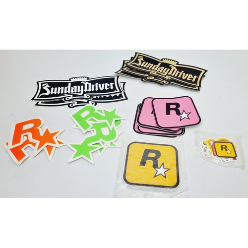 211 - Rockstar Games promotional items: fifty Social Club badges, table tennis balls and assorted stickers... 