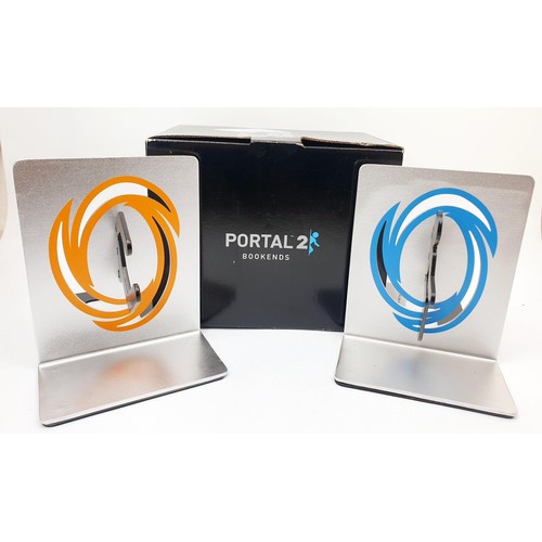 112 - A set of scarce boxed ThinkGeek Portal 2 aluminium Video Game Bookends. UK shipping £14.