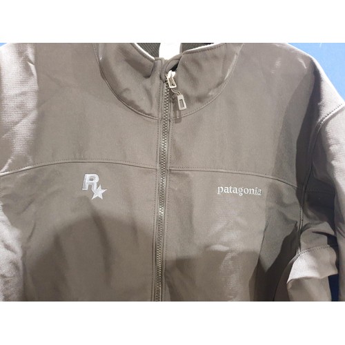 125 - A Rockstar Games employee Patagonia men's black jacket, size large. UK shipping £14.