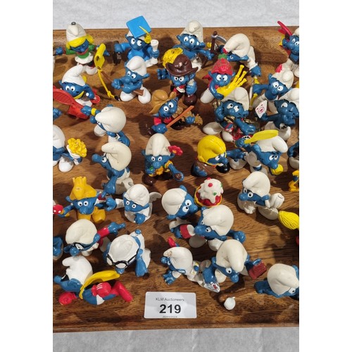 219 - Approximately seventy five Smurf figures by Peyo/Schleich. UK shipping £14.