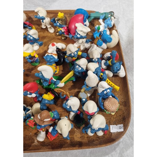 219 - Approximately seventy five Smurf figures by Peyo/Schleich. UK shipping £14.