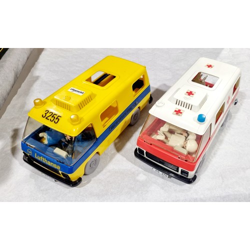 215 - Two boxes of vintage Playmobil figures and accessories including Lufthansa shuttle bus, caravan and ... 