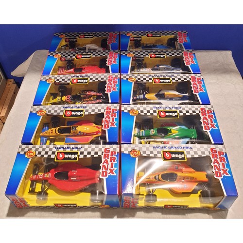 257 - Ten boxed 1/24 scale Burago Grand Prix Cars. UK Shipping £14.