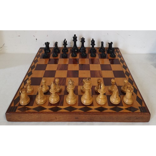 217 - A vintage Staunton style weighted wooden chess set, one piece A/F, and a board. UK shipping £14.