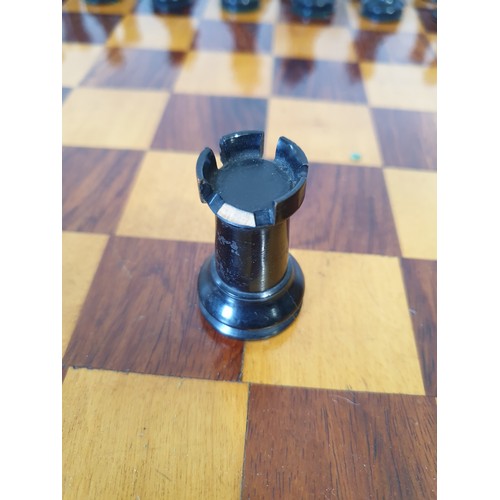 217 - A vintage Staunton style weighted wooden chess set, one piece A/F, and a board. UK shipping £14.