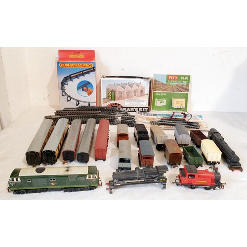 311 - A collection of 'OO' gauge engines, rolling stock, track and buildings. UK shipping £14.