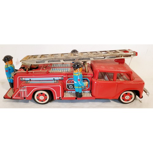 312 - A vintage tin plate push along MF718 fire engine with original box lid. UK shipping £14.