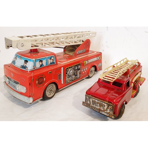 313 - A vintage tin plate Horikawa battery operated fire engine and a tin plate push along fire engine. UK... 