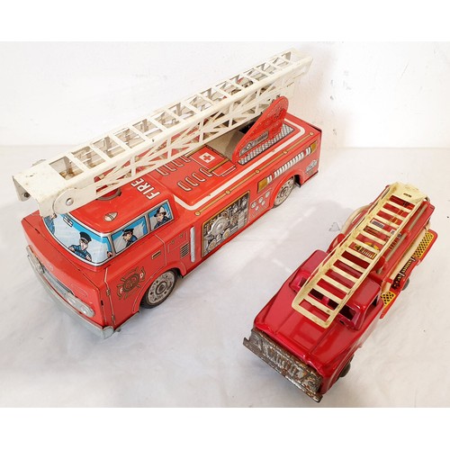 313 - A vintage tin plate Horikawa battery operated fire engine and a tin plate push along fire engine. UK... 