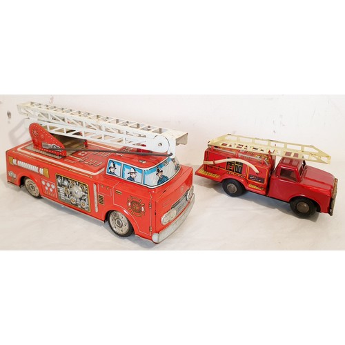 313 - A vintage tin plate Horikawa battery operated fire engine and a tin plate push along fire engine. UK... 