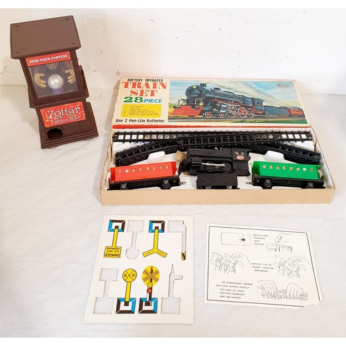 318 - Vintage boxed games and toys including a Cosmo Train Set, Trix train, track and others. UK shipping ... 