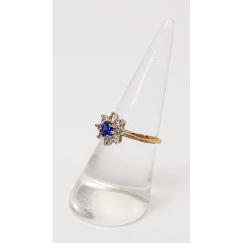 6 - A hallmarked 9ct gold cluster ring set with sapphire and clear stones, gross weight 1.7g, size O. UK... 