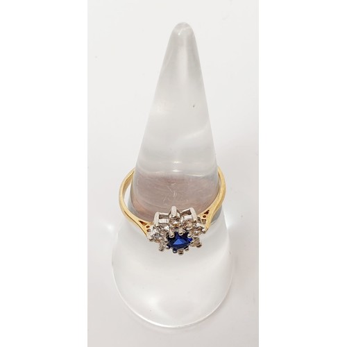 6 - A hallmarked 9ct gold cluster ring set with sapphire and clear stones, gross weight 1.7g, size O. UK... 