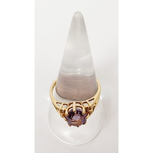 7 - A hallmarked 9ct gold and amethyst ring, gross weight 3g, size R. UK shipping £14.