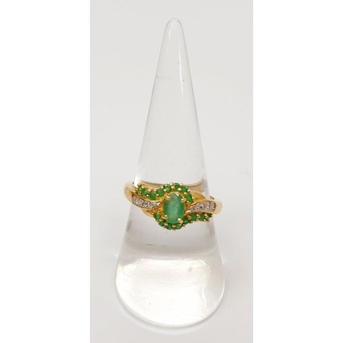 8 - A hallmarked 9ct gold ring set with diamond and green stones, gross weight 3g, size P/Q. UK shipping... 