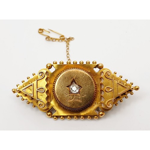 29 - A Victorian yellow metal brooch set with a diamond A/F, width 5.5g, gross weight 10.8g. UK shipping ... 