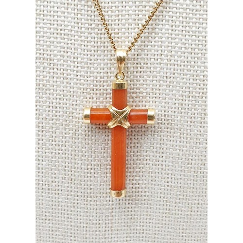 38 - A carnelian and 14ct gold cross on a hallmarked 9ct gold chain, chain length 43cm, gross weight 5.1g... 