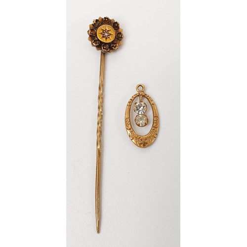 41 - A 15ct gold stick pin set with a diamond together with a 9ct gold pendant set with clear stones, gro... 