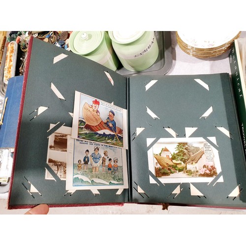 66 - A postcard album containing mainly antique and vintage greetings cards. UK shipping £14.