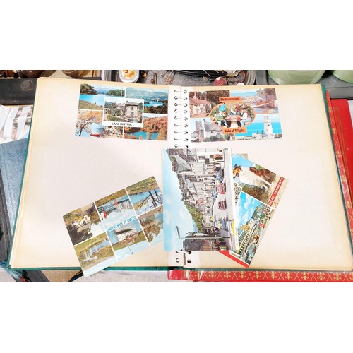 67 - A selection of six postcard and photograph albums. UK shipping £14.