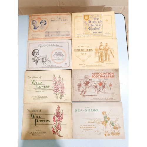 69 - A selection of cigarette card albums. UK shipping £14.