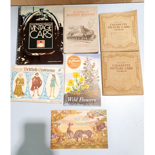 69 - A selection of cigarette card albums. UK shipping £14.