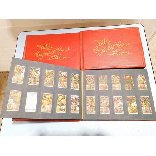 69 - A selection of cigarette card albums. UK shipping £14.