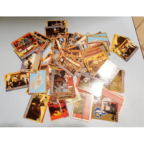 70 - A selection of Jurassic Park trading cards, vintage stickers including Batman, football sticker card... 