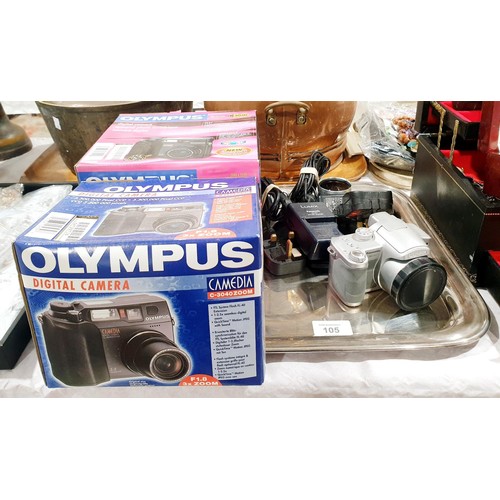 105 - Two new in box Olympus C-3040 cameras together with a Panasonic Lumix DMC-FZ7 camera. UK shipping £1... 