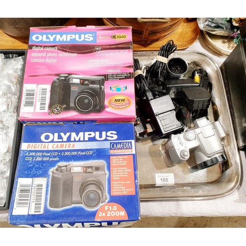 105 - Two new in box Olympus C-3040 cameras together with a Panasonic Lumix DMC-FZ7 camera. UK shipping £1... 