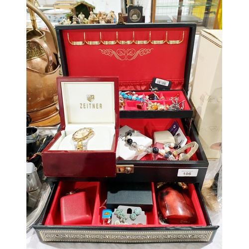 106 - A jewellery box and contents. UK shipping £14.