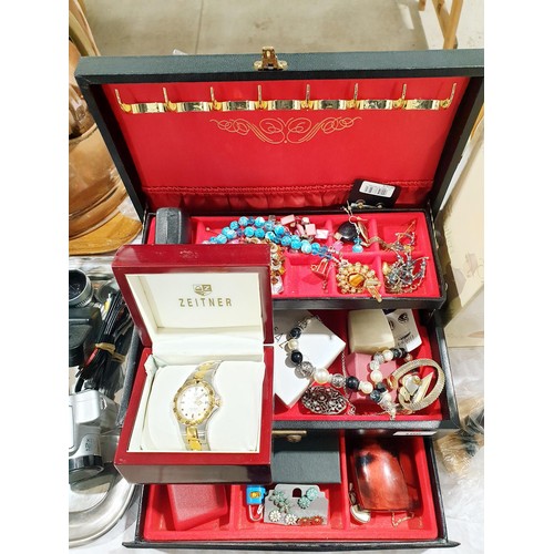 106 - A jewellery box and contents. UK shipping £14.