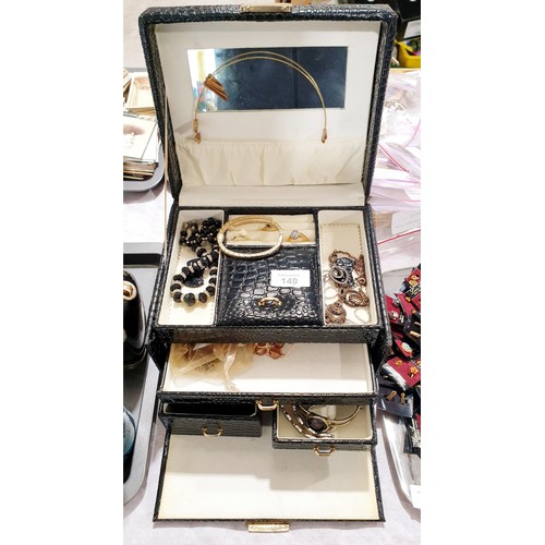 149 - A jewellery box and contents. UK shipping £14.