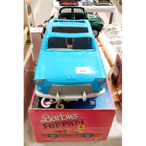 242 - A vintage Barbie's Ferrari box (no car) together with Ron Weasley's Ford Anglia and a Sylvanian Fami... 