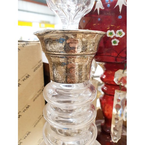 88 - A cut crystal decanter with a hallmarked silver collar A/F, together with a cranberry lustre, A/F an... 