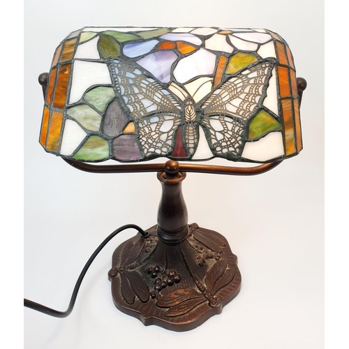 276 - A Tiffany style table lamp with metal base and butterfly motif, height 31cm. No shipping. Arrange co... 