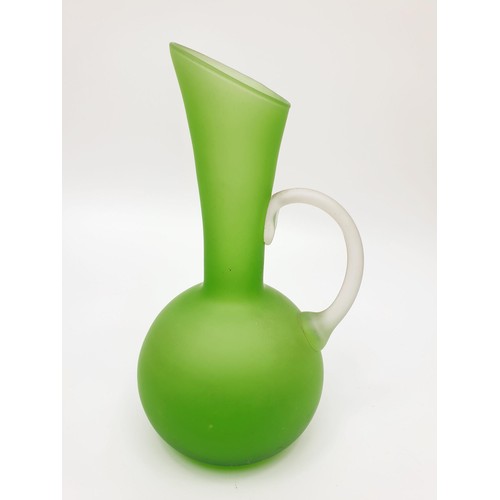 280 - A 1920/30s green glass jug, height 21cm. No shipping. Arrange collection or your own packer and ship... 