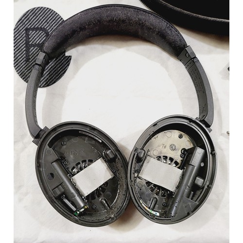 213 - A pair of wired Bose QuietComfort 15 Acoustic Noise Cancelling headphones with new unused ear foam. ... 