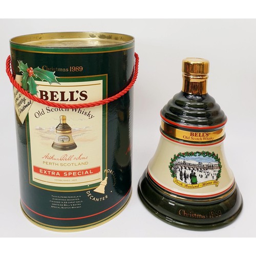 40 - Two boxed Bell's Scotch Whisky in Wade porcelain decanters for Christmas 1989 and 1990, each 75cl. N... 