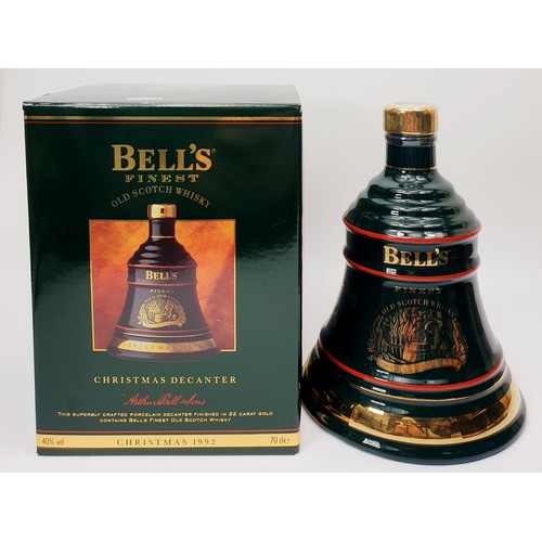 42 - Three bottles of Bell's Scotch Whisky in Wade porcelain decanters for Christmas 1992, 1993 and 1995.... 