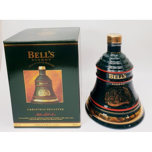 42 - Three bottles of Bell's Scotch Whisky in Wade porcelain decanters for Christmas 1992, 1993 and 1995.... 