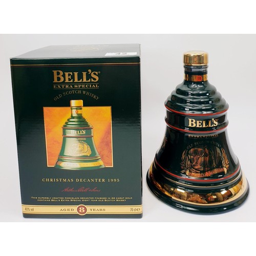 42 - Three bottles of Bell's Scotch Whisky in Wade porcelain decanters for Christmas 1992, 1993 and 1995.... 