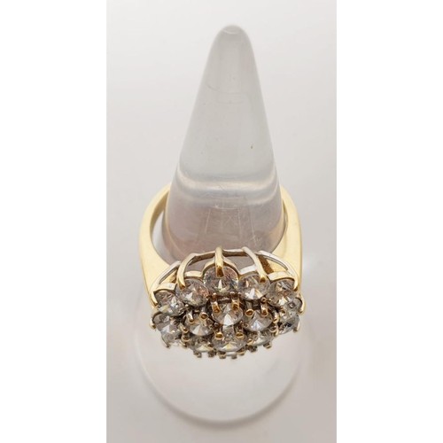 48 - A hallmarked 9ct gold cluster ring set with clear stones, gross weight 5.1g, size K/L. UK shipping £... 