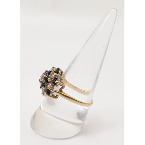 50 - A 9ct gold cluster ring set with cubic zirconia, gross weight 3.6g, size P. UK shipping £14.